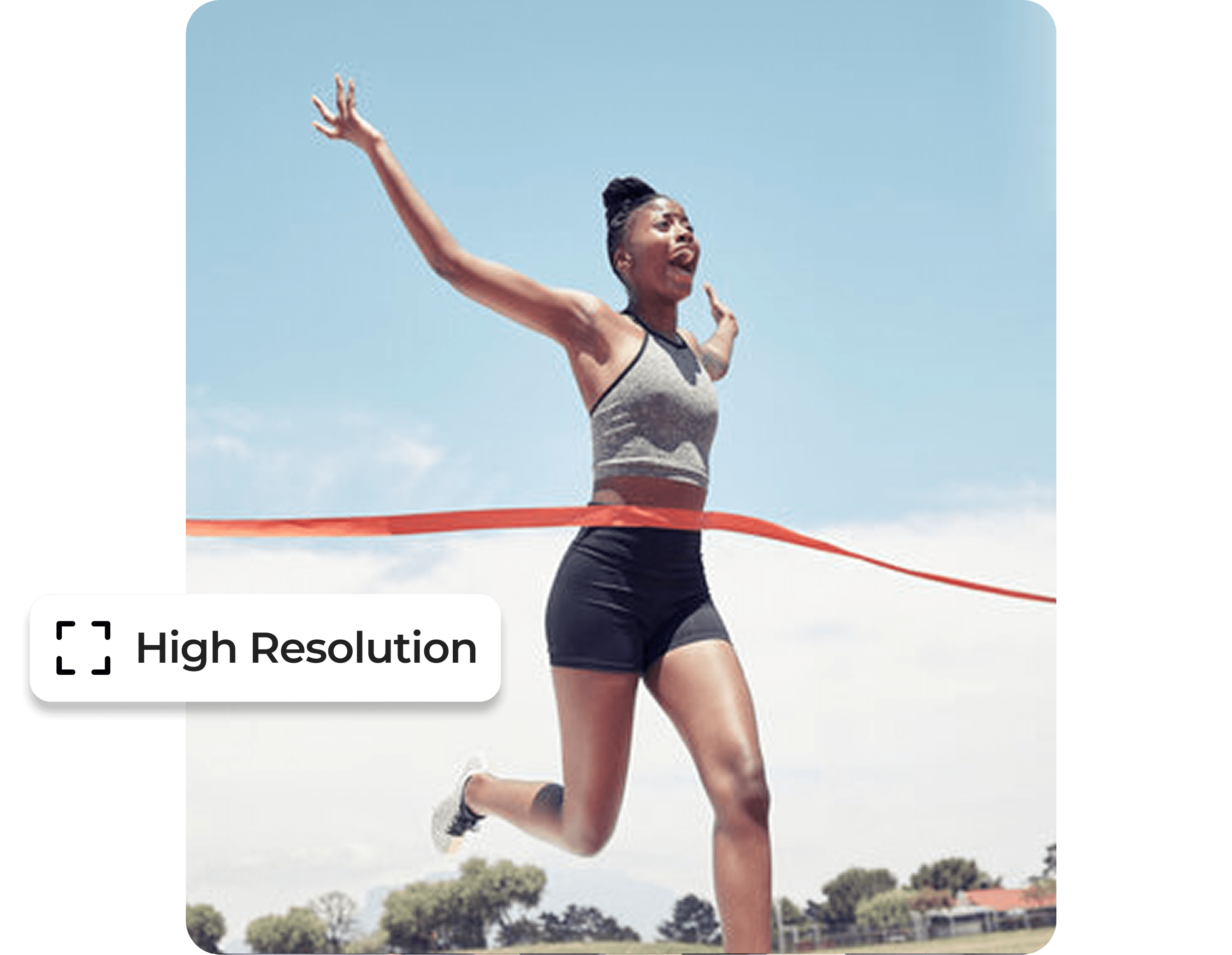 Female runner triumphantly crossing finish line